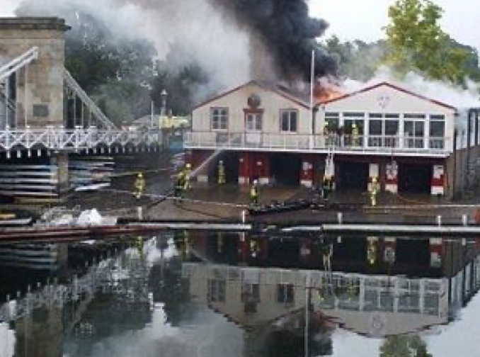 The fire at Marlow Rowing Club showing flames coming from the roof on the bridge side